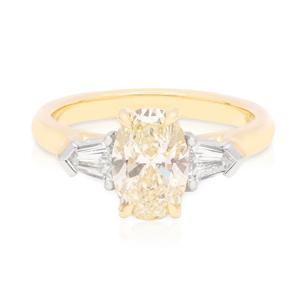 Oval and Bullet Diamond Trilogy Engagement Ring