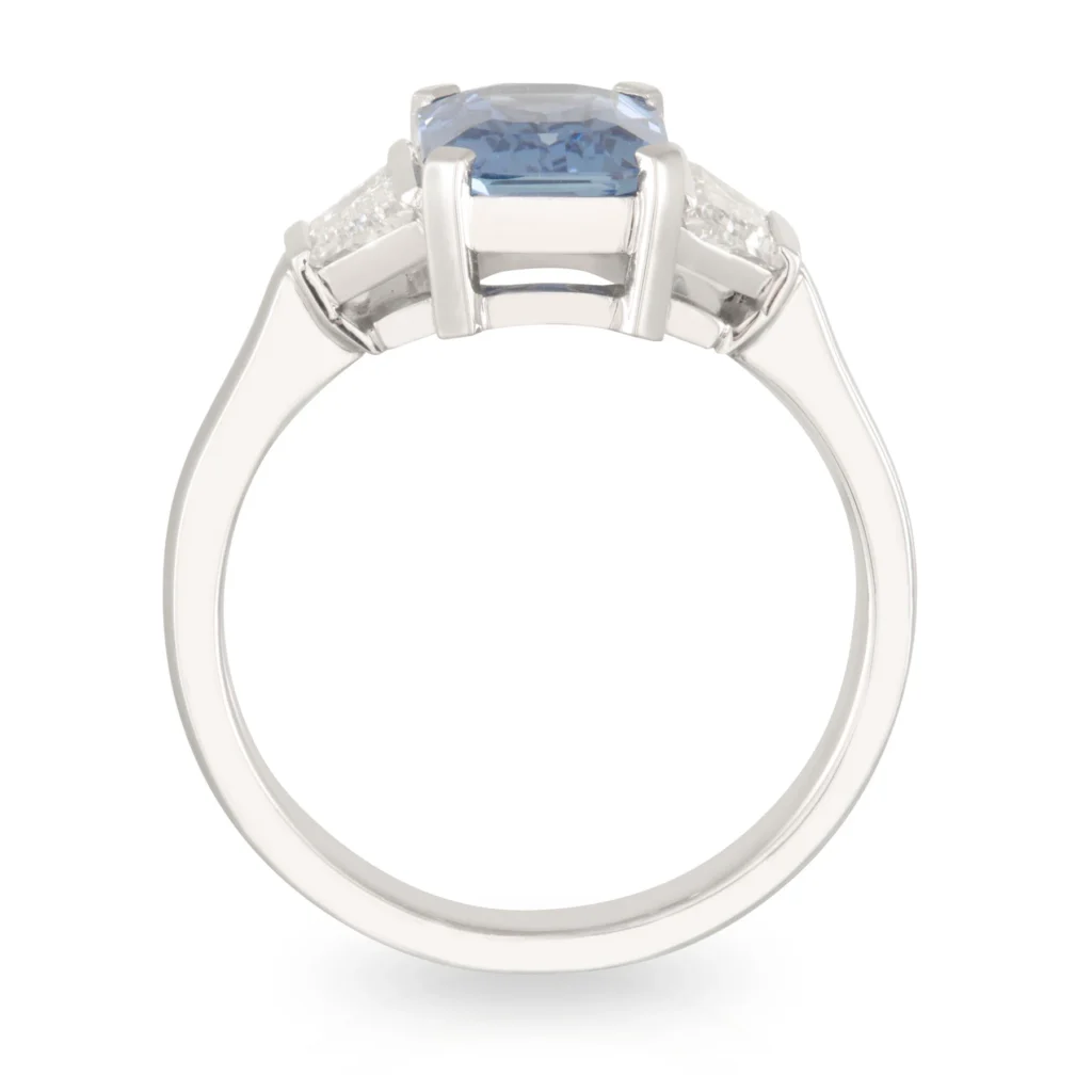 Sapphire and Trapezoid Diamond Trilogy Engagement Ring
